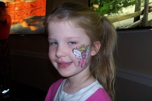 Young girl at Mavericks game with Mavs Princess painted on her face